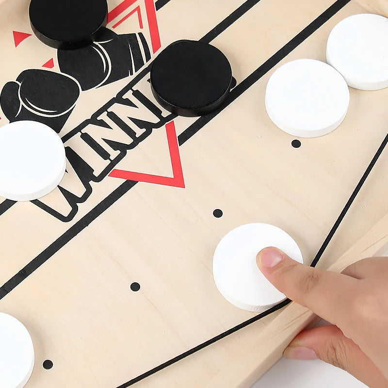 TABLE GAME WITH PUCKS AND ELASTIC