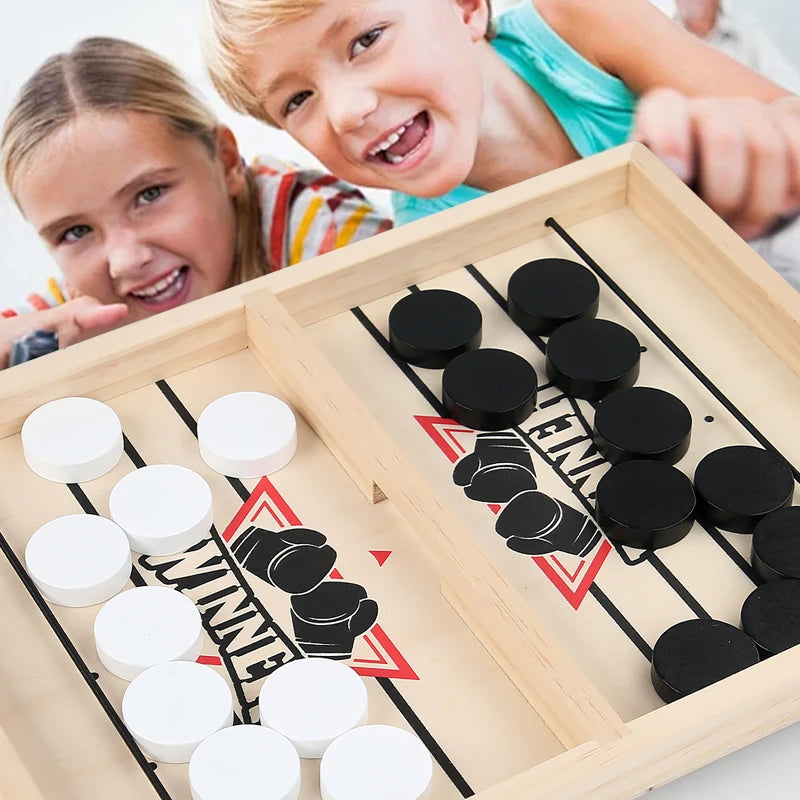 TABLE GAME WITH PUCKS AND ELASTIC