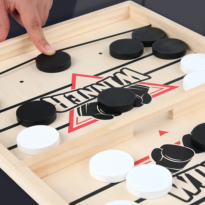 TABLE GAME WITH PUCKS AND ELASTIC